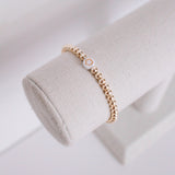 gold beaded symbol bracelet